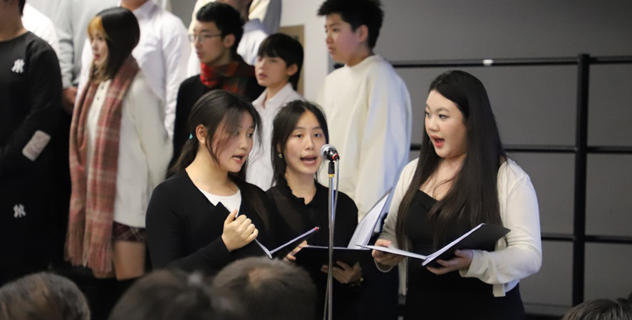 Students singing during a concert