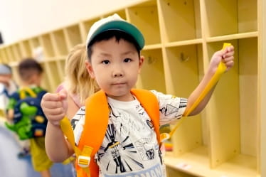 little kid wearing a backpack