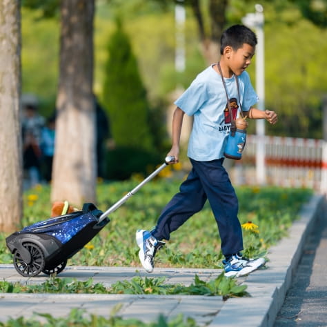 Students carrying his bag on campus