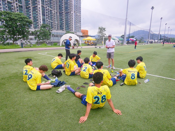 Boys football team between games at ACAMIS 2024 in Hong Kong