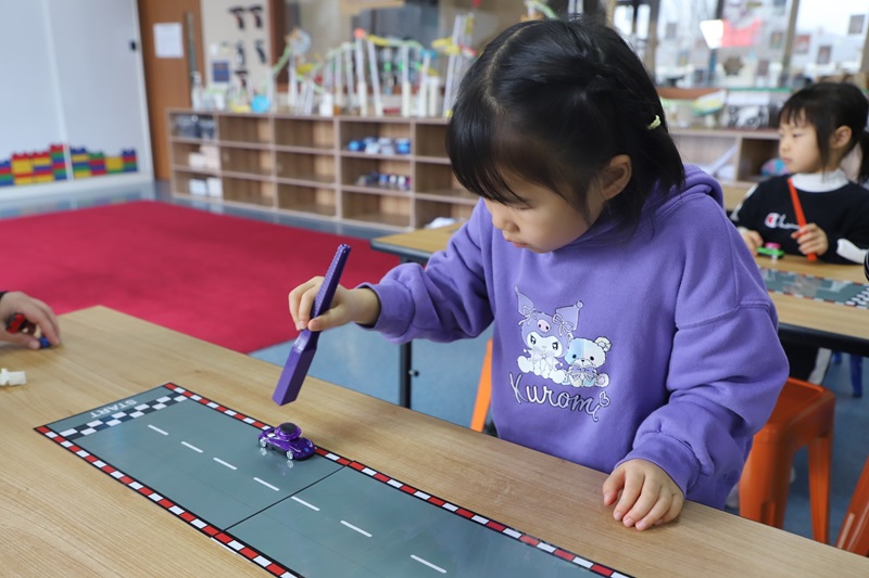 Pre-Kindergarten students playing with magnets