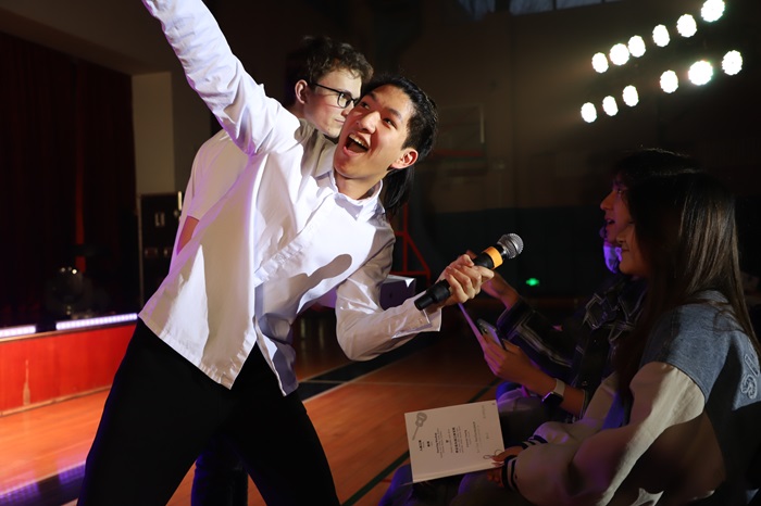 Show emcees working with the audience