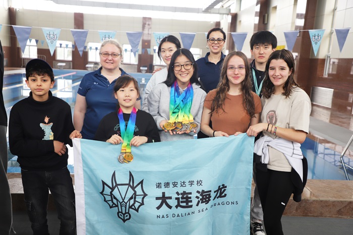 Swimming team and coaches