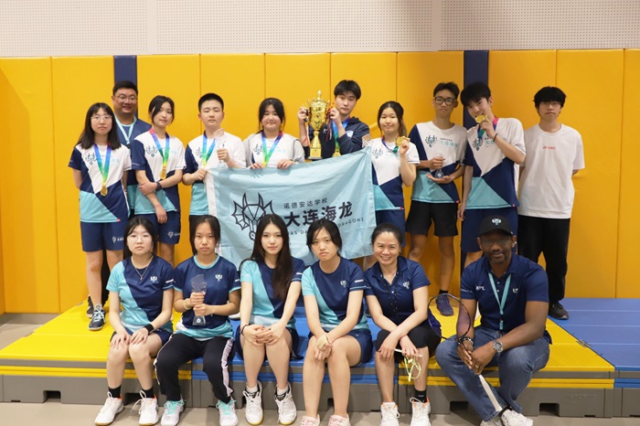 Badminton team and coaches