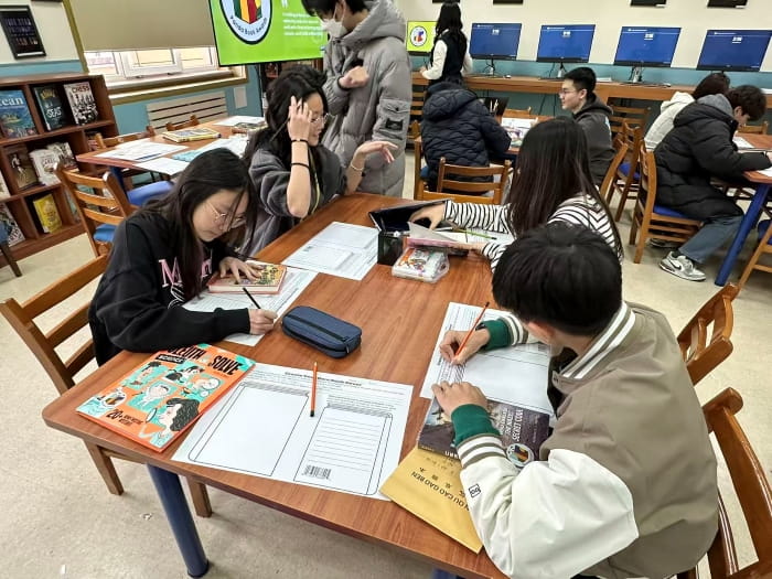 student designing book cover