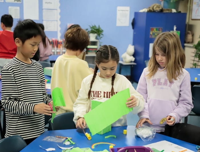 students choose materials to create a magic creature trap