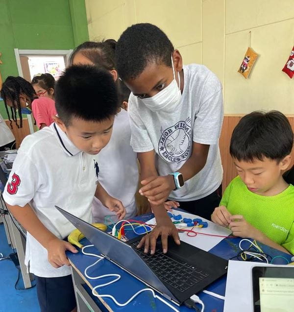 Aman volunteering for a STEM Class stem class
